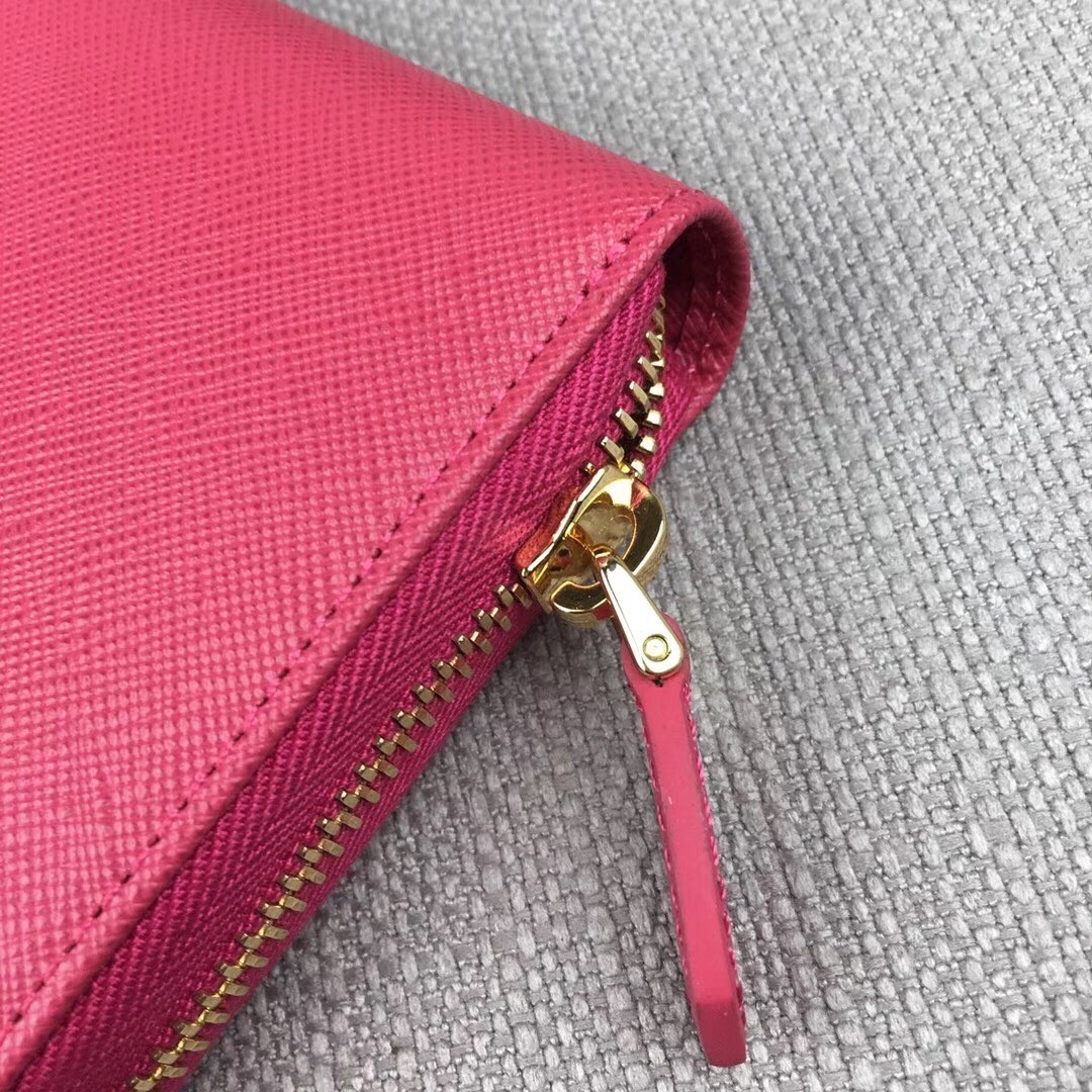 Prada Zipped Wallet In Pink Saffiano Leather 560