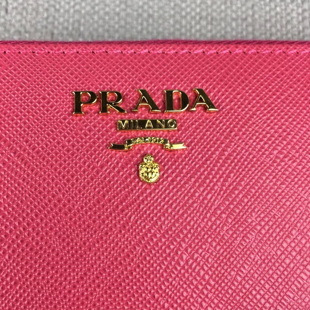 Prada Zipped Wallet In Pink Saffiano Leather 560